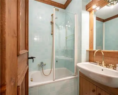a bathroom with a shower and a sink and a tub at ca peziè in Zuel