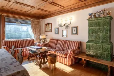 a living room with two couches and a table at ca peziè in Zuel