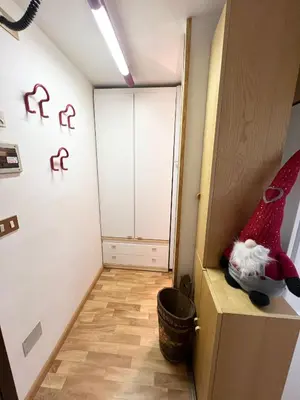 a room with a door with a santa hat sitting on a cabinet at Cambra AGB in Campestrin