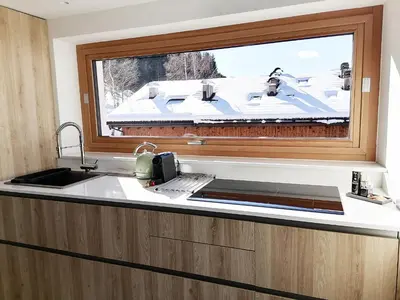 a kitchen with a sink and a window at Villa Re Laurino Suite Tra le nuvole in Moena