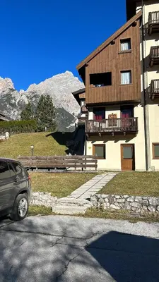 a view of a mountain with the sun in the sky at Ca' Pelmo in San Vito di Cadore