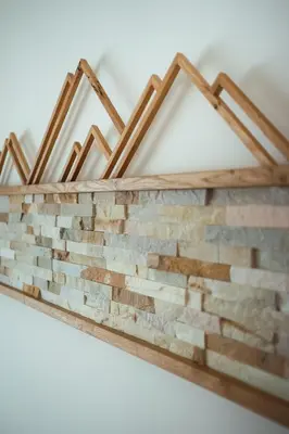 a brick wall hanging on a wall at Nature Apartments Stifter in Villabassa
