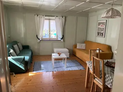 a living room with a couch and a table at Ciasa Luciana in Moena