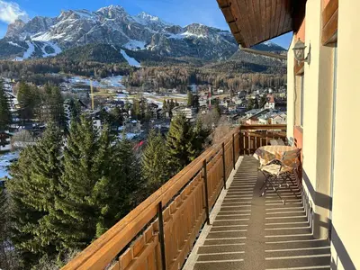 a balcony with a view of the mountains at Appartamento 3 camere pieno centro di Cortina in Cortina dʼAmpezzo