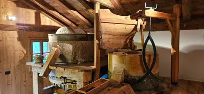 a room with a bunch of barrels in a building at Molin in Vigo di Fassa