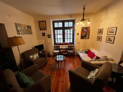 a living room with couches and a table at Ca' Il Guscio in Cortina dʼAmpezzo