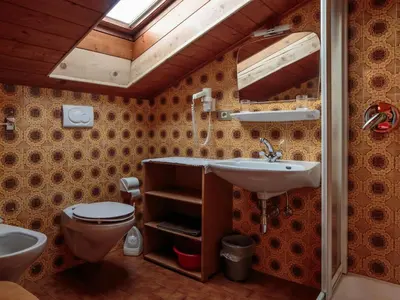 a bathroom with a toilet and a sink at Apartment mit privatem Balkon by Interhome in Ortisei