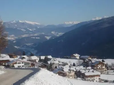 a town in the snow on a mountain at Apartment Haus Adler by Interhome in Maranza