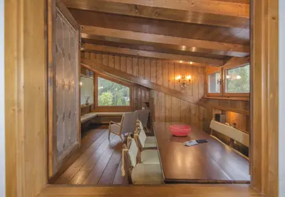 a view of a room with a table in a house at Appartamento panoramico vicino centro in Cortina dʼAmpezzo