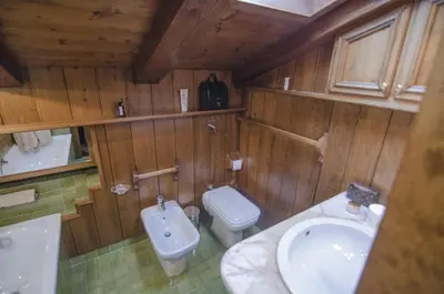 a bathroom with a toilet and a sink at Appartamento panoramico vicino centro in Cortina dʼAmpezzo