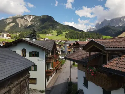 a view of a village with mountains in the background at Fermeda in Villnoss
