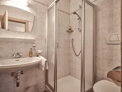 a bathroom with a shower and a sink at Fermeda in Villnoss
