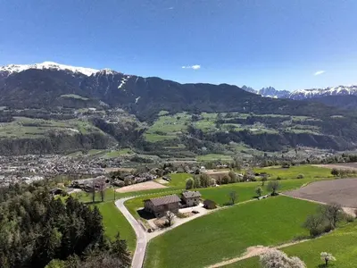 an aerial view of a village in the mountains at Praterhof Chalet in Südtirol - Natur, Ruhe & Bergblick in Bressanone