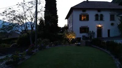 a white house with a lawn in front of it at Linslhof in Terlano