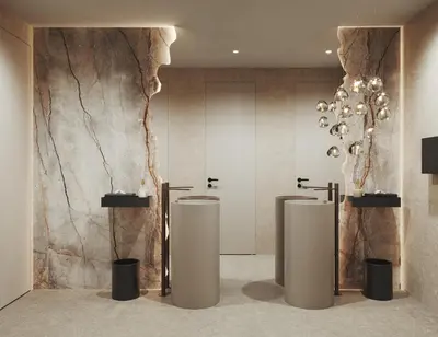 a bathroom with three urinals and a marble wall at My Mountain Moments - Cave Design Hotel in Selva dei Molini