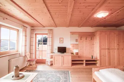 a room with a desk and a computer in it at Berggasthof Messnerhof in Barbiano