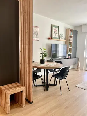 a dining room with a table and chairs at The Cozy Peak - 360 Dolomites View in Agordo