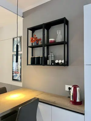 a kitchen with a counter with a red tea kettle at The Cozy Peak - 360 Dolomites View in Agordo