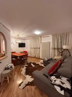 a living room with a couch and a table at Ciasa Cermis in Cavalese