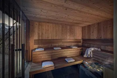 a wooden sauna with two sinks in it at Sorafurcia Lodge in Sorafurcia