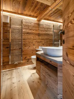 a wooden bathroom with a sink and a toilet at Casa Poligrafica 2, panoramica e super confortevole in Cortina dʼAmpezzo