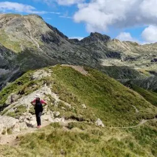 a person walking on a path on a mountain at Gasthof Greif in Sarntal