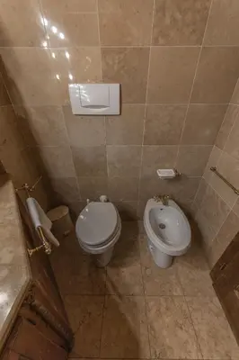 a bathroom with a toilet and a bidet at Casa Verzi, comoda e confortevole in pieno centro in Cortina dʼAmpezzo