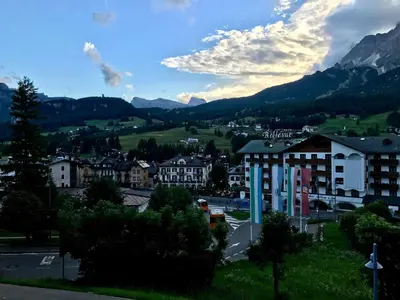 a view of a town with mountains in the background at Brand new beautiful ground floor flat in Cortina dʼAmpezzo