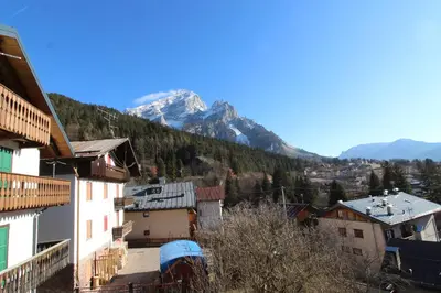 a view of a town with mountains in the background at Casa Tomà Mountain View Cortina in San Vito di Cadore