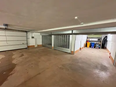 an empty garage with two garage stalls in it at Selva loft in Selva di Cadore