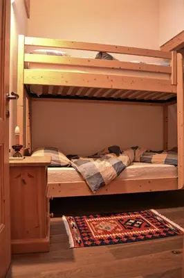 a bunk bed in a room with at Casa Micol in Moena
