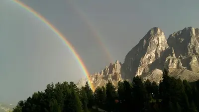 a double rainbow in front of a mountain at Brunelle, Obertörgglerhof in Brixen