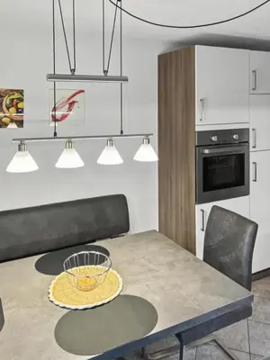 a kitchen with a table with a bowl on it at Ruhige Dachwohnung mit Bergblick - Passeiertal in Saltusio