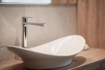 a white sink sitting on top of a counter at Deluxe Apartments Lantl in Falzes