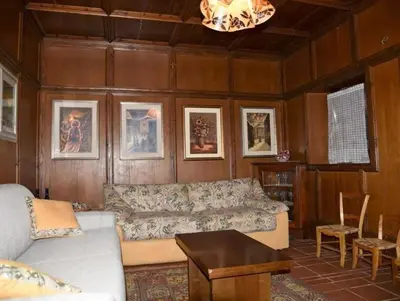 a living room with a couch and a table at Casa Via Soia in Canale dʼAgordo