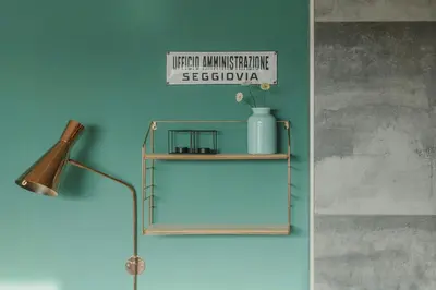 a shelf with a lamp and a sign on a wall at Cozy Apartment At The Foot Of The Dolomites in Campitello di Fassa
