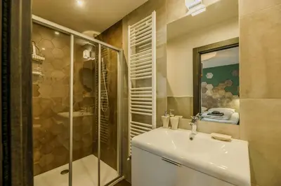 a bathroom with a sink and a shower at Family-Friendly Mountain Home In The Dolomites in Campitello di Fassa