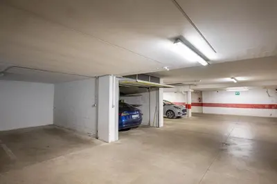 an empty parking garage with a car parked in it at Paola in Santa Cristina in Val Gardena