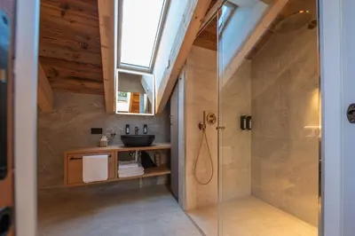 a bathroom with a white toilet and a sink at Il rifugio dei sogni - Exclusive Apartments in San Sigismondo