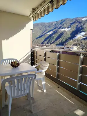 a balcony with a table and chairs and a view at Bergblick 33 in Plaus