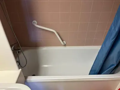 a bathroom with a tub and a toilet and a shower curtain at Bilocale Casa Canazei in Alba di Canazei