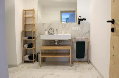 a bathroom with a sink and a mirror at Fox Appartements in San Lorenzo di Sebato