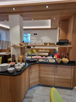 a kitchen with a counter with food on it at Garni Ciamorc in Canazei
