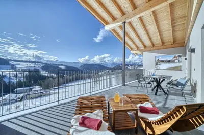 a room with a bed and a kitchen with a view at Hinterrainerhof - Nature Apartments in Avelengo
