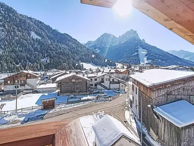 a view of a town with snow covered mountains at Apartment Valeria by Interhome in Pera