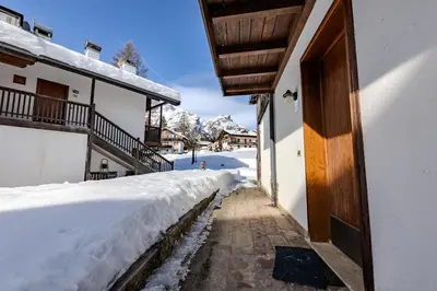 a door to a house in the snow at Casa Irene in Mareson