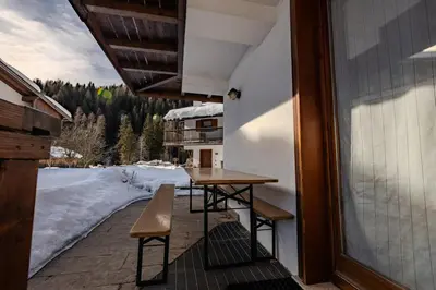 a table and chairs on the balcony of a house at Casa Irene in Mareson