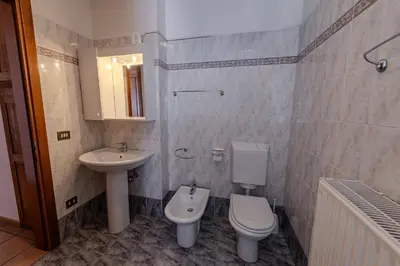 a bathroom with a toilet and a sink at Casa Irene in Mareson