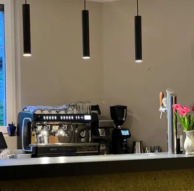 a kitchen with a toaster oven on a counter at Hotel Jardis in Lana