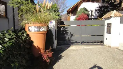 a house with a gate with plants on it at Villa Sissi in Laives